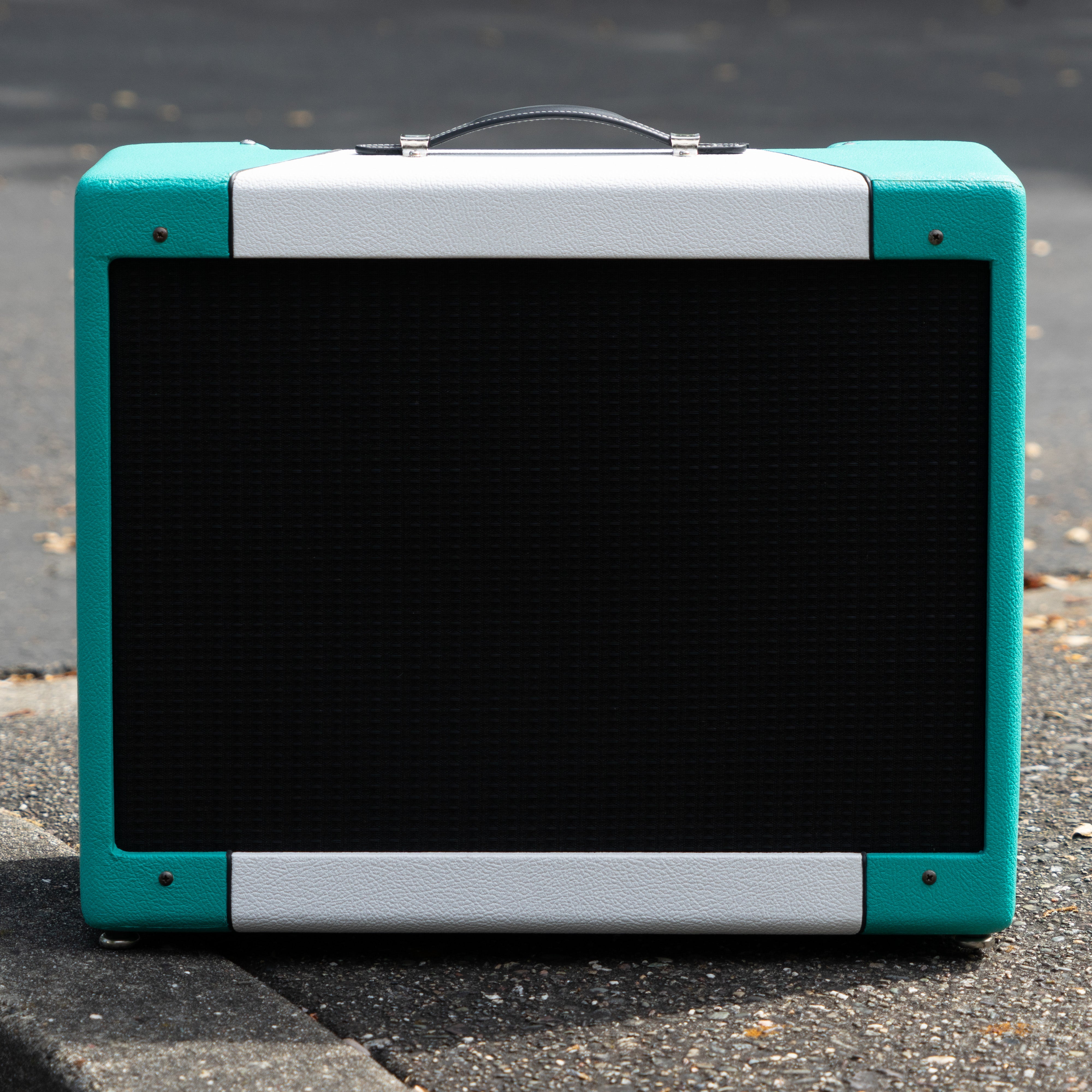 Teal & white narrow panel 5E3 Deluxe amplifier cabinet with black grille, raised handle, and chrome feet.